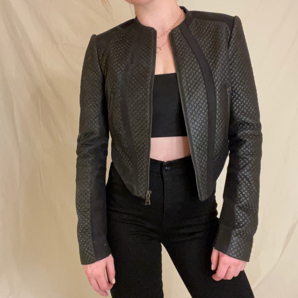 Black fitted, sexy, going out jacket.